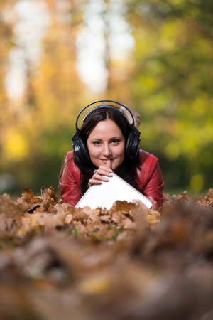 Smiling Female Listening To Music Autumnの写真素材