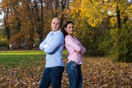 Happy Young Couple With Arms Crossedの写真素材