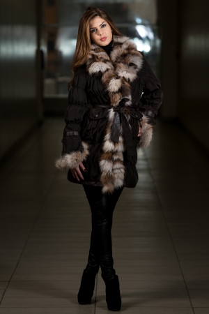 Fashion Girl Wearing Snow Jacket In Shopping Mallの写真素材
