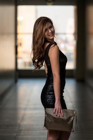 Fashion Model From Behind In Beautiful Black Dressの写真素材