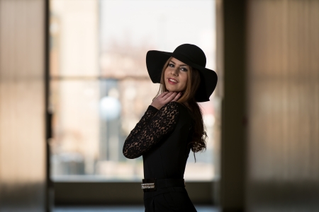 Elegant Lady With Stylish Hat And Leather Bagの写真素材