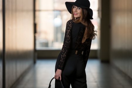 Elegant Lady With Stylish Hat And Leather Bagの写真素材
