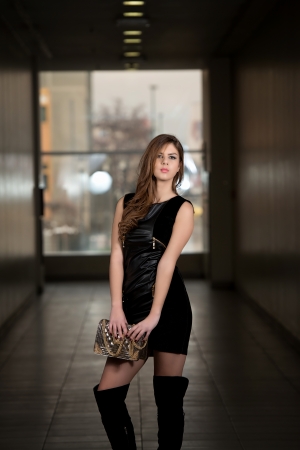 Sexy Girl In Leather Dress With A Bagの写真素材