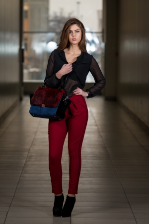 Gorgeous Woman Wearing Red Pants And Chiffon Long Sleeveの写真素材
