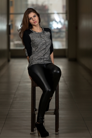 Beautiful Young Model Sitting On The Stoolの写真素材