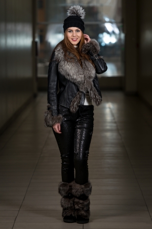 Happy Young Woman Wearing Black Hatの写真素材