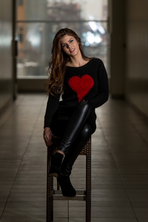 Beautiful Young Model Sitting On The Stoolの写真素材