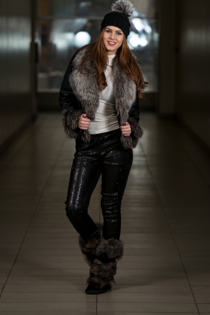 Happy Young Woman Wearing Black Hatの写真素材