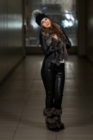 Happy Young Woman Wearing Black Hatの写真素材
