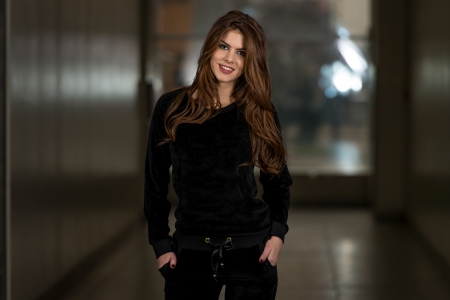 Beautiful Woman Wearing Fashion Tracksuit In Blackの写真素材