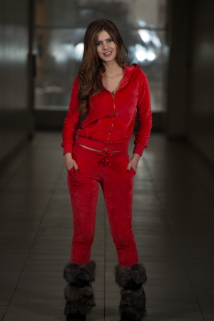 Beautiful Woman Wearing Fashion Track Suit In Redの写真素材