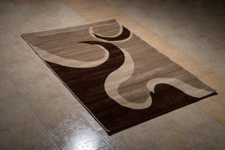 Single Brown Carpet Folded On Floorの写真素材