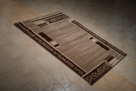 Single Brown Carpet Folded On Floorの写真素材