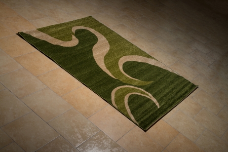 Single Green Carpet Folded On Floorの写真素材