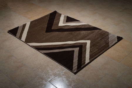 Single Brown Carpet Folded On Floorの写真素材
