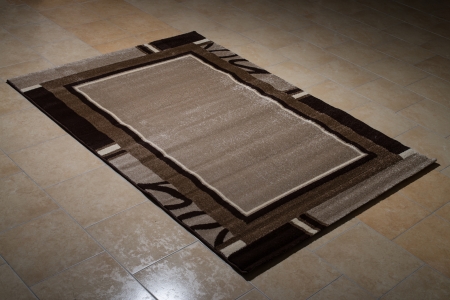 Single Brown Carpet Folded On Floorの写真素材
