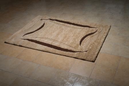 Single Brown Carpet Folded On Floorの写真素材