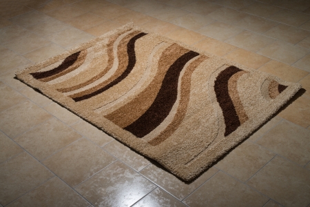 Single Brown Carpet Folded On Floorの写真素材