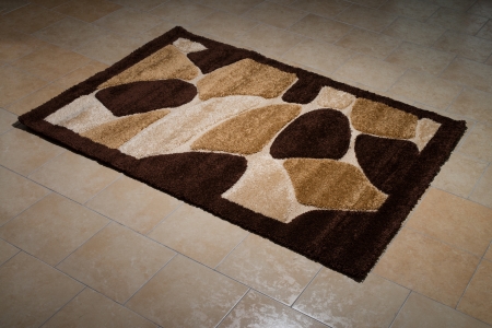 Single Brown Carpet Folded On Floorの写真素材