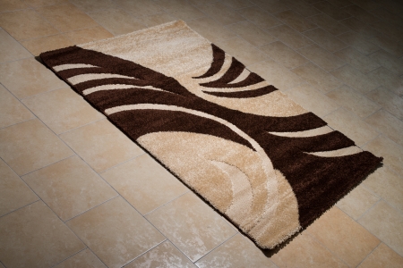 Single Brown Carpet Folded On Floorの写真素材