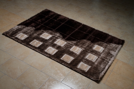 Black Pattern Carpet Lying On Floorの写真素材