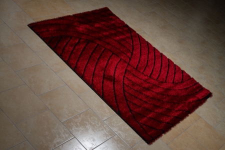 Single Red Carpet Folded On Floorの写真素材
