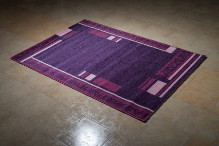Single Purple Carpet Folded On Floorの写真素材