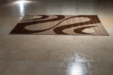Single Brown Carpet Folded On Floorの写真素材