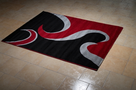 Single Red Carpet Folded On Floorの写真素材
