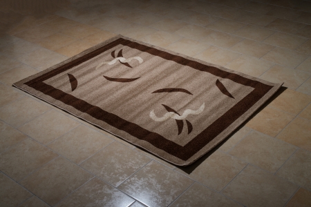 Single Brown Carpet Folded On Floorの写真素材
