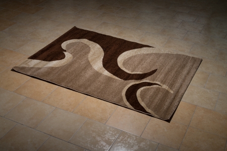Single Brown Carpet Folded On Floorの写真素材