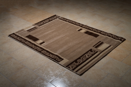 Single Brown Carpet Folded On Floorの写真素材