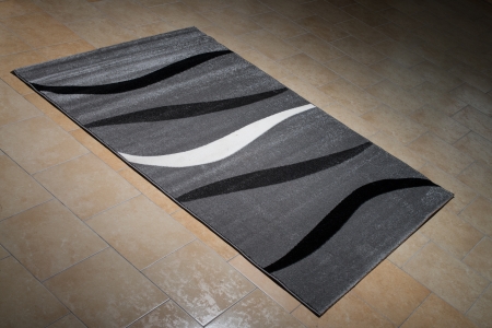 Black Pattern Carpet Lying On Floorの写真素材