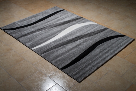 Black Pattern Carpet Lying On Floorの写真素材