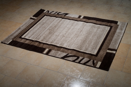 Single Brown Carpet Folded On Floorの写真素材