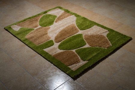 Single Green Carpet Folded On Floorの写真素材