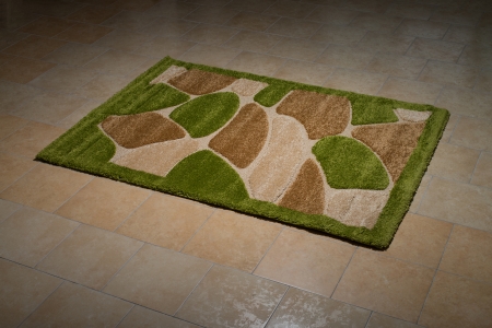 Single Green Carpet Folded On Floorの写真素材