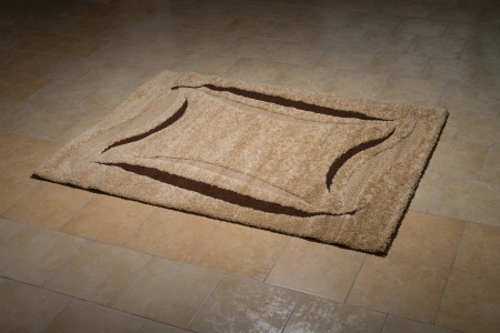 Single Brown Carpet Folded On Floorの写真素材