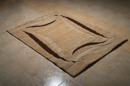 Single Brown Carpet Folded On Floorの写真素材