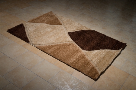 Single Brown Carpet Folded On Floorの写真素材