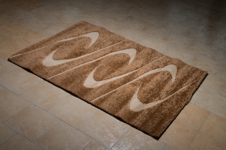 Single Brown Carpet Folded On Floorの写真素材