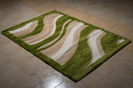 Single Green Carpet Folded On Floorの写真素材