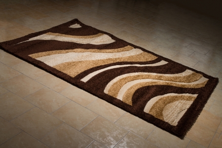 Single Brown Carpet Folded On Floorの写真素材
