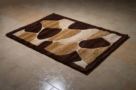 Single Brown Carpet Folded On Floorの写真素材