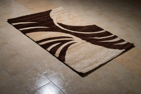 Single Brown Carpet Folded On Floorの写真素材