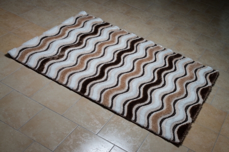 Black Pattern Carpet Lying On Floorの写真素材