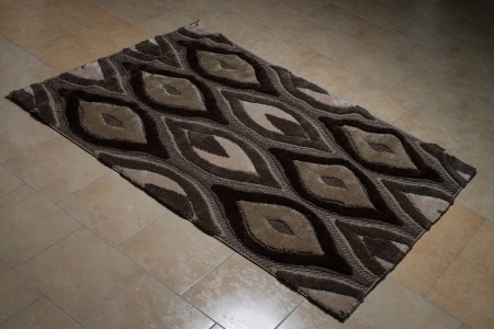 Black Pattern Carpet Lying On Floorの写真素材