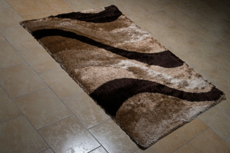 Brown Pattern Carpet Lying On Floorの写真素材