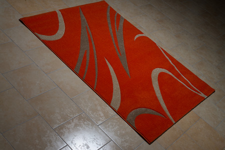 Single Red Carpet Folded On Floorの写真素材