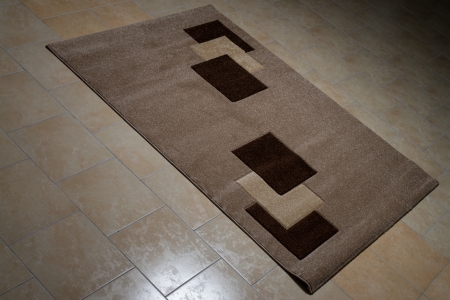 Brown Pattern Carpet Lying On Floorの写真素材